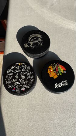 Various Blackhawks pucks