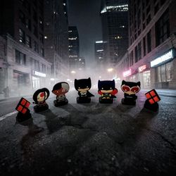Lot #4 Circle K Exclusive DC Herostix Chibi Style Batman/Catwoman/Symbol Badges. 
These items are DC Herostix collectibles, which were offered as a pr