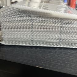 92 page binder of baseball and football cards