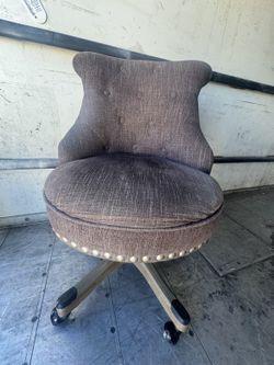 brown upholstered swivel chair