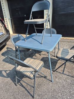 Folding table and 5 matching chairs