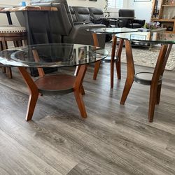 Round glass top coffee table with matching end tables