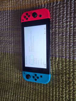 Nintendo Switch with docking station, controllers and cartidge games
