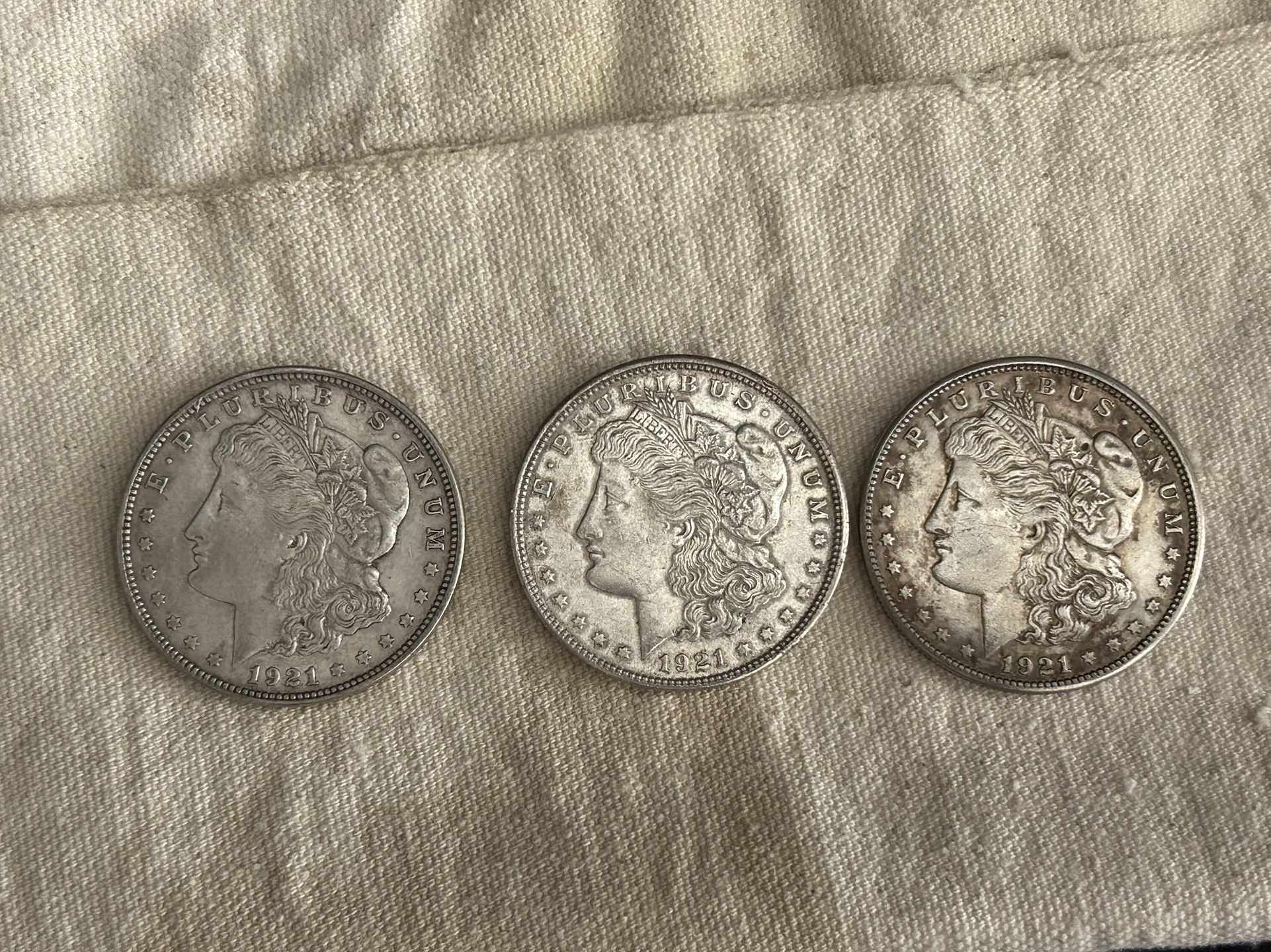 AU / UNC Morgan Dollars