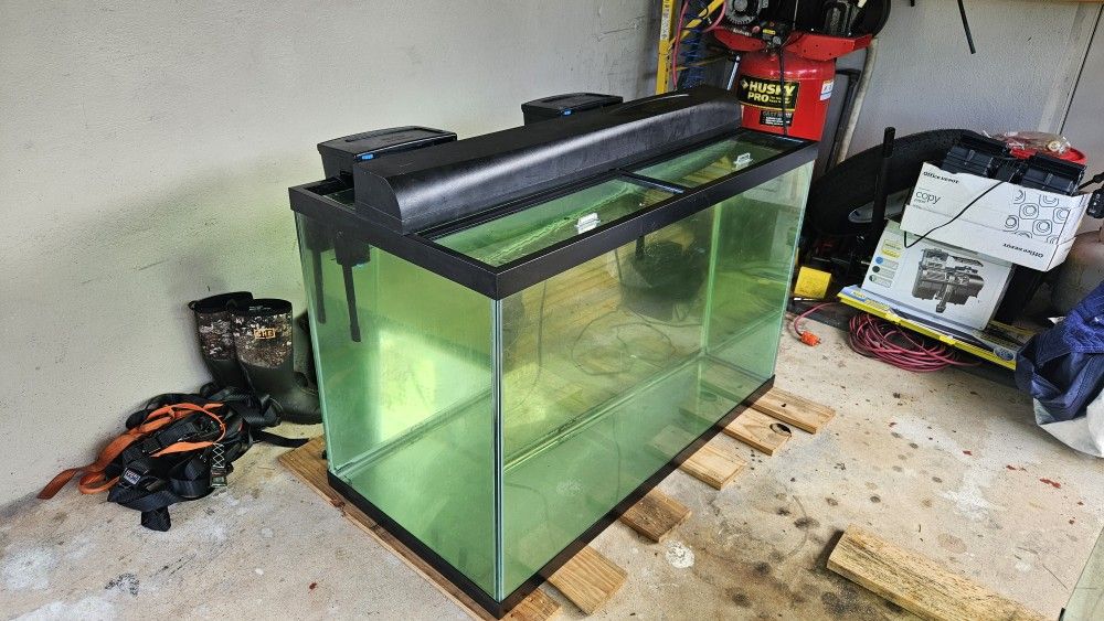 150 gallon tall aquarium fish tank with stand, light, glass lids, and 2 tidal 110 filters.