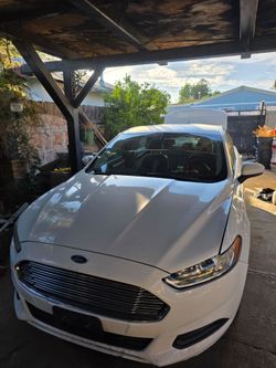 Salvage title 2015 Ford Fusion S