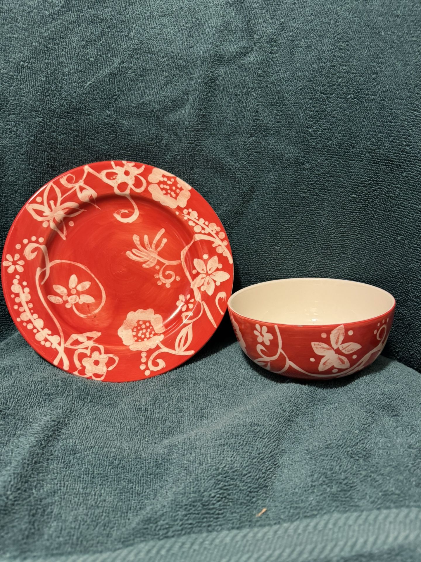 Two bright red and yellow bowl/salad plate sets
