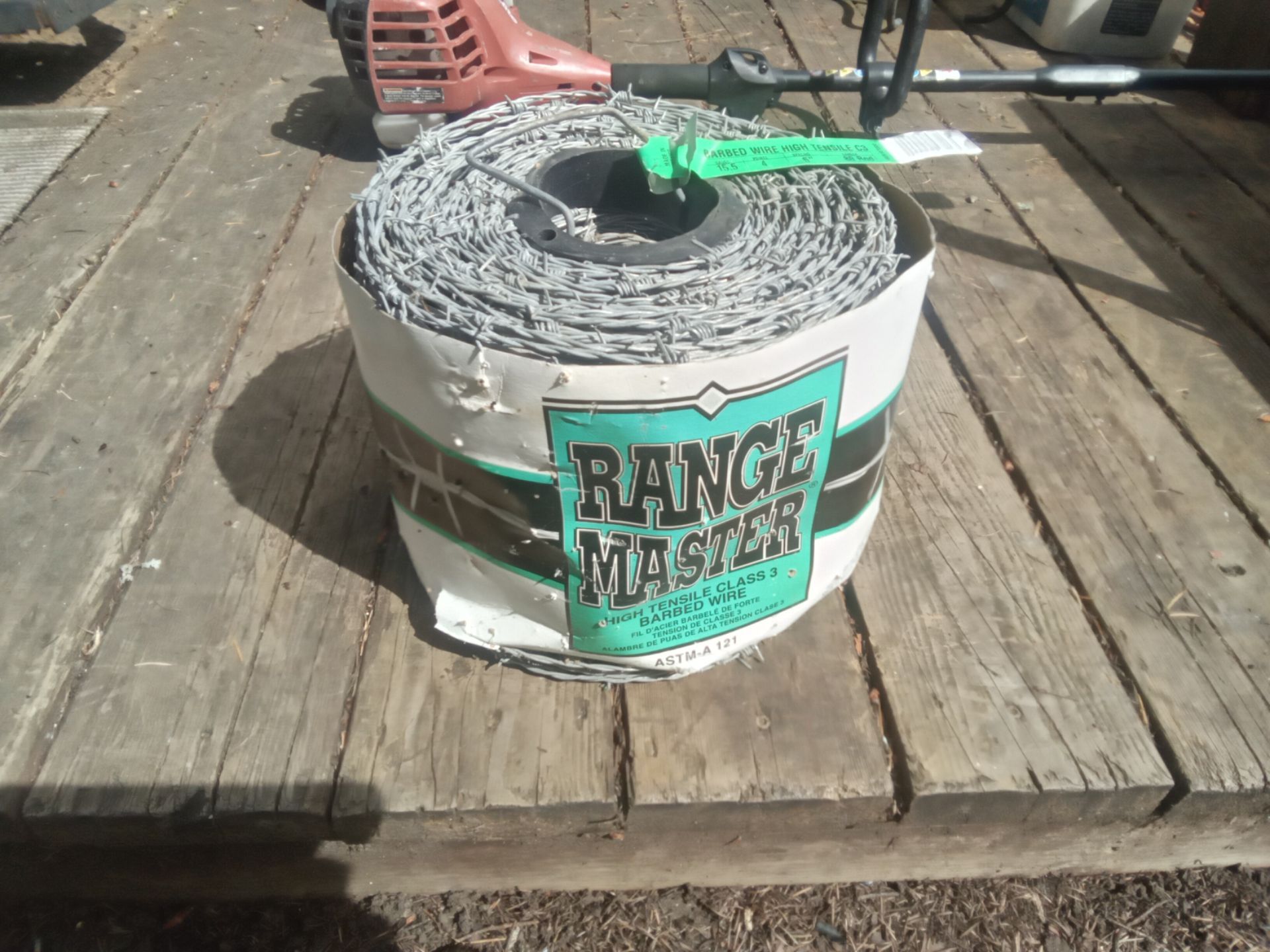 New Spool of Range Master Barbed Wire, 1320' feet long, New Condition. $30.00.
