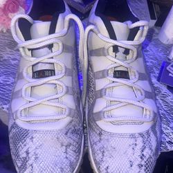 preowned mens size 13 Air Jordan 11 Retro Low LE Light Bone Snakeskins in great condition located Off lake mead and Simmons area asking $75