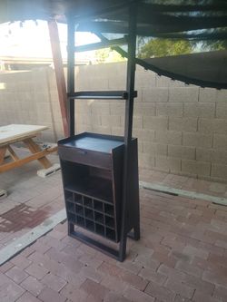 Wine  shelf ,wood  made, needs  a little  touching, I ASK  $50.00