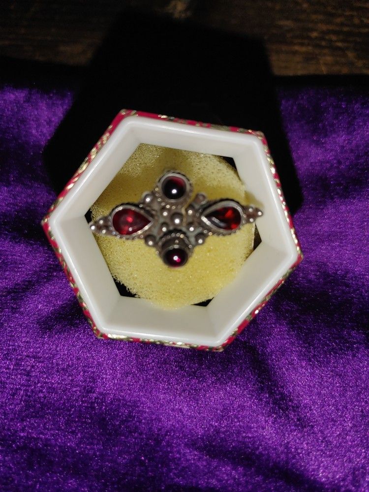 Red Stone Set In Silver Ring.
