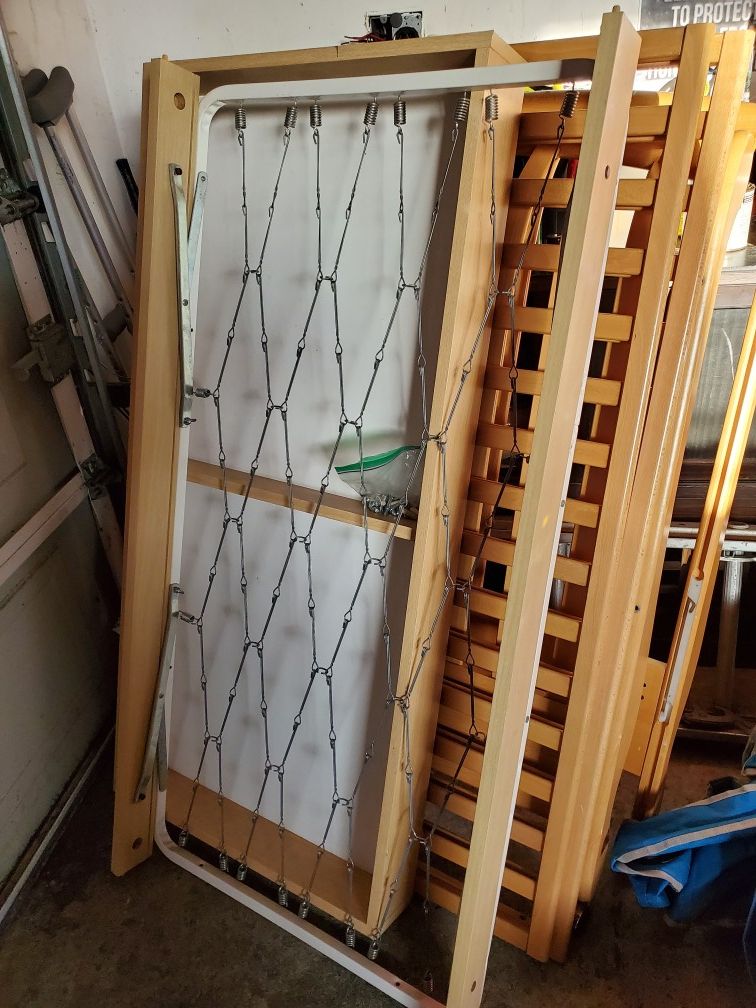 Crib with pull out storage underneath.