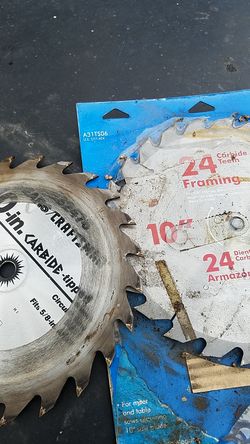 Two 10 inch carbide blades one use one New