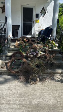 Multiple grape wine, straw, and twig wreathes