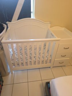 White Baby Crib with Attached Changing Table
