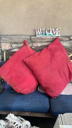 2 burgundy sofa pillows