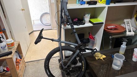 Hard tail mountain bike with fat tires, missing fork gooseneck, and handlebars