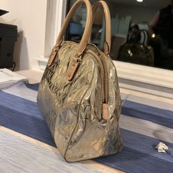 MK gold shine purse
