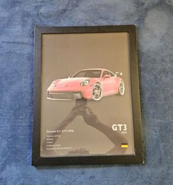 Porche poster in a frame (frame has damage)