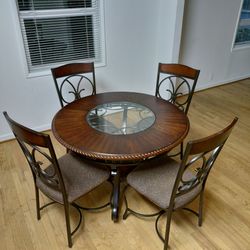 Dark wood dining table with chairs