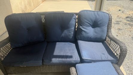 Patio furniture with table and fire pit