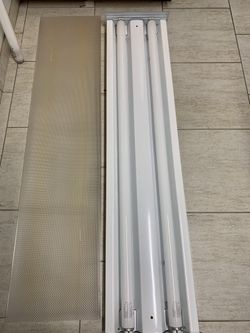 Fluorescent lighting fixture with extra bulbs