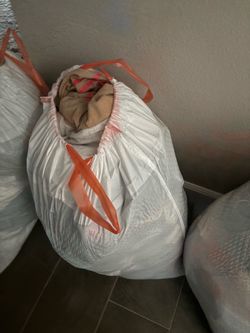 Large trash bag of men’s shirts