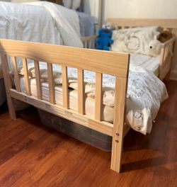 Toddler’s wooden bed with mattress