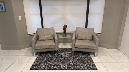 Two chairs with chrome legs
