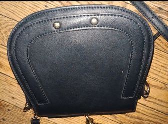 Black crossbody pocketbook handbag shape as a horseshoe