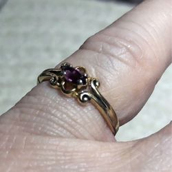 A small Marquis-cut amethyst graces this vintage ring.  Size 6 1/2. 
