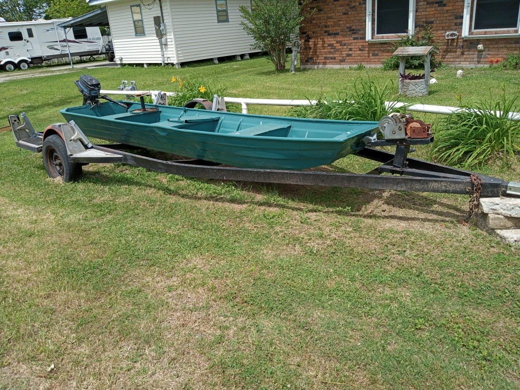 14 Ft Aluminum Sharpshooter With Live Well And Rod Holders With A 40 Mercury On The Back Next