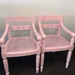 two pink statement chairs