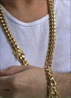 New 18 k yellow gold Cuban link chain and bracelet