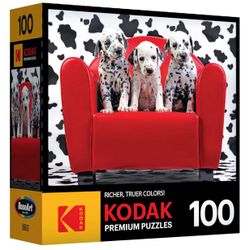 KODAK 3 Dalmatian  puppies sitting on a bright red couch 100 puzzle piece.