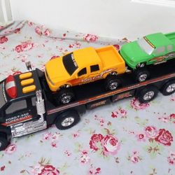 Plastic towing trailer with 2 plastic truck