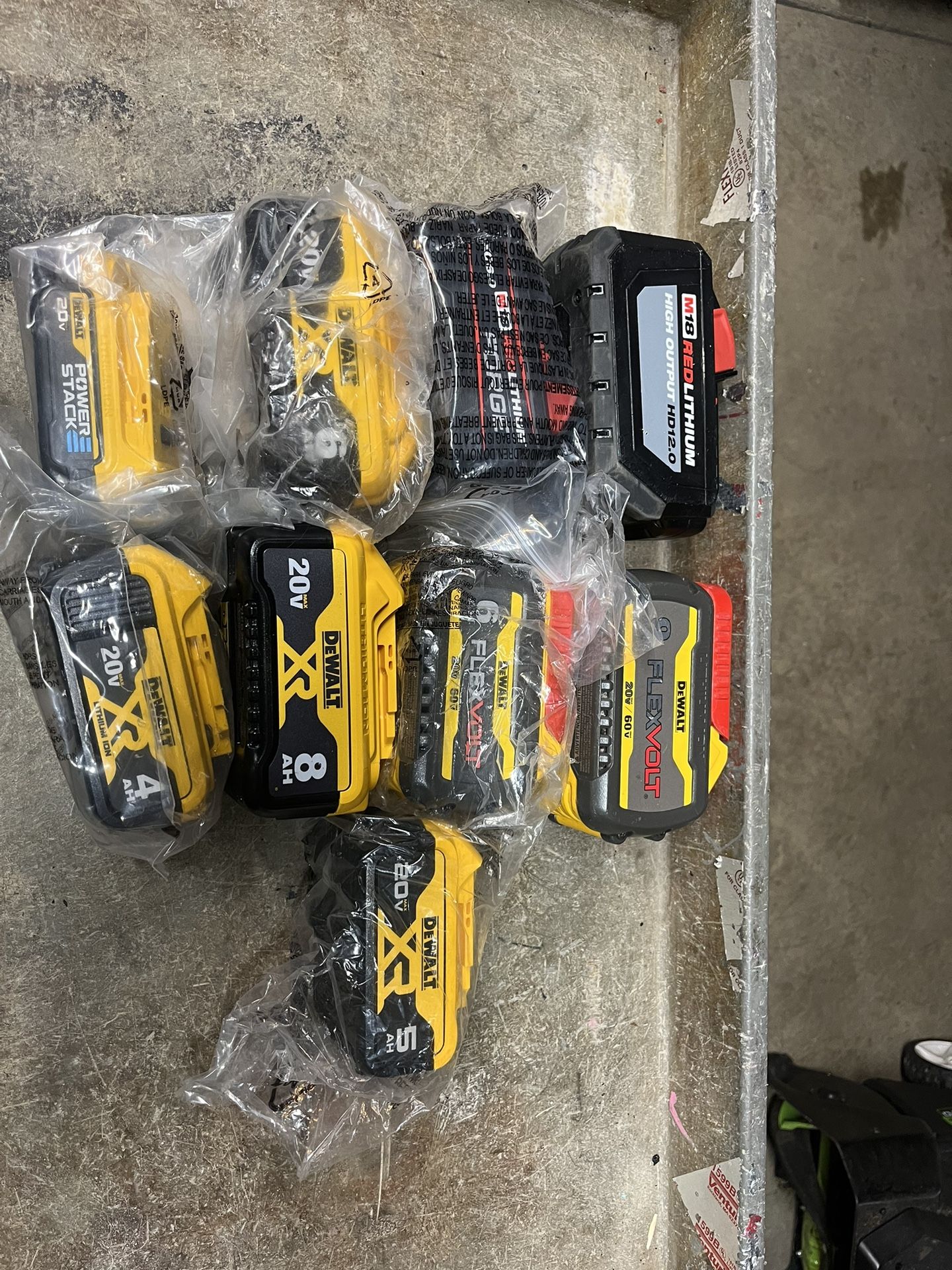 Assorted Milwaukee and DeWalt batteries