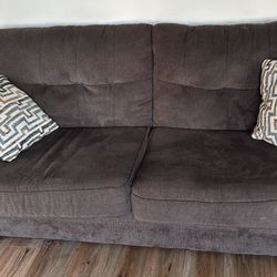 Brown Love Seat With Pillows