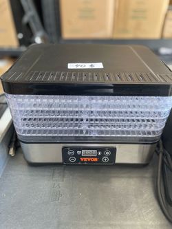 Awesome VEVOR food dehydrator. Has digital controls and multiple clear trays. Great for making dried fruits, veggies, or jerky. Used once for a trial 