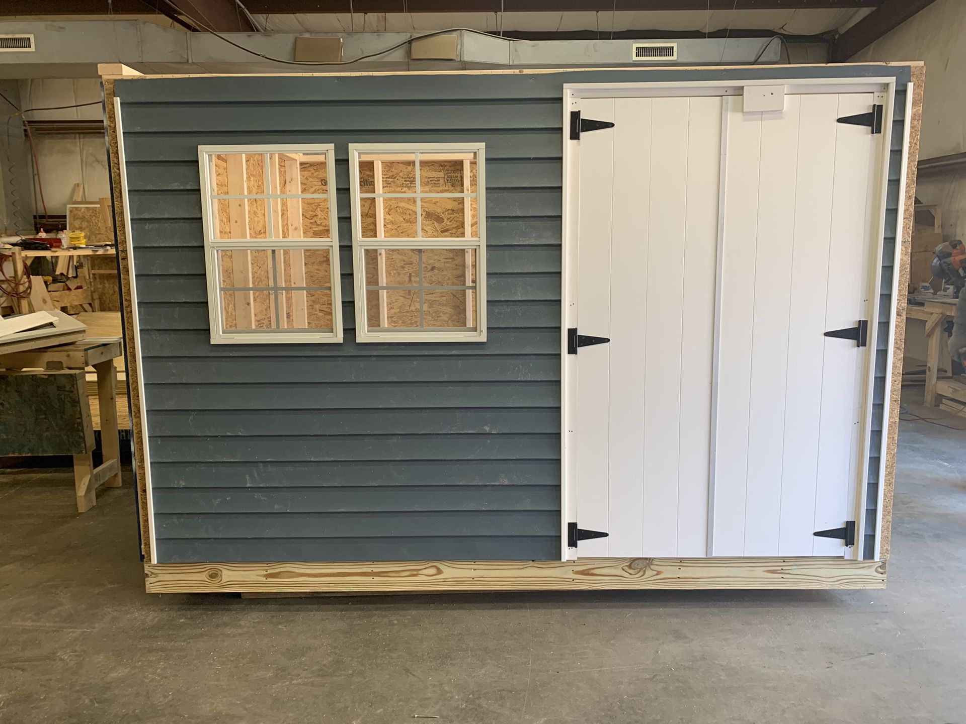 8x10 vinyl shed , peak roof 40” double door