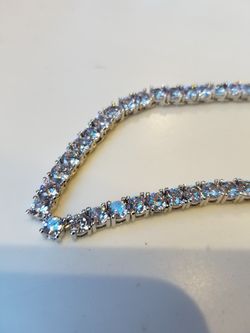 one row chains....c.z...silver or gold color