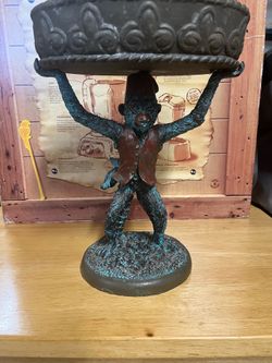Vintage hard resin monkey holding a serving platter