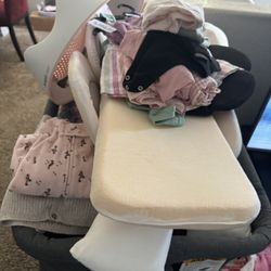 Bassinet And Baby Clothes