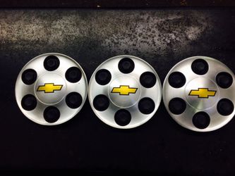 3 center caps off a Chevy Suburban