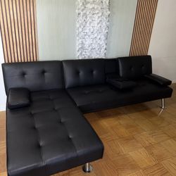 LuxuryGoods Modern Faux Leather Futon with Cupholders and Pillows, Black