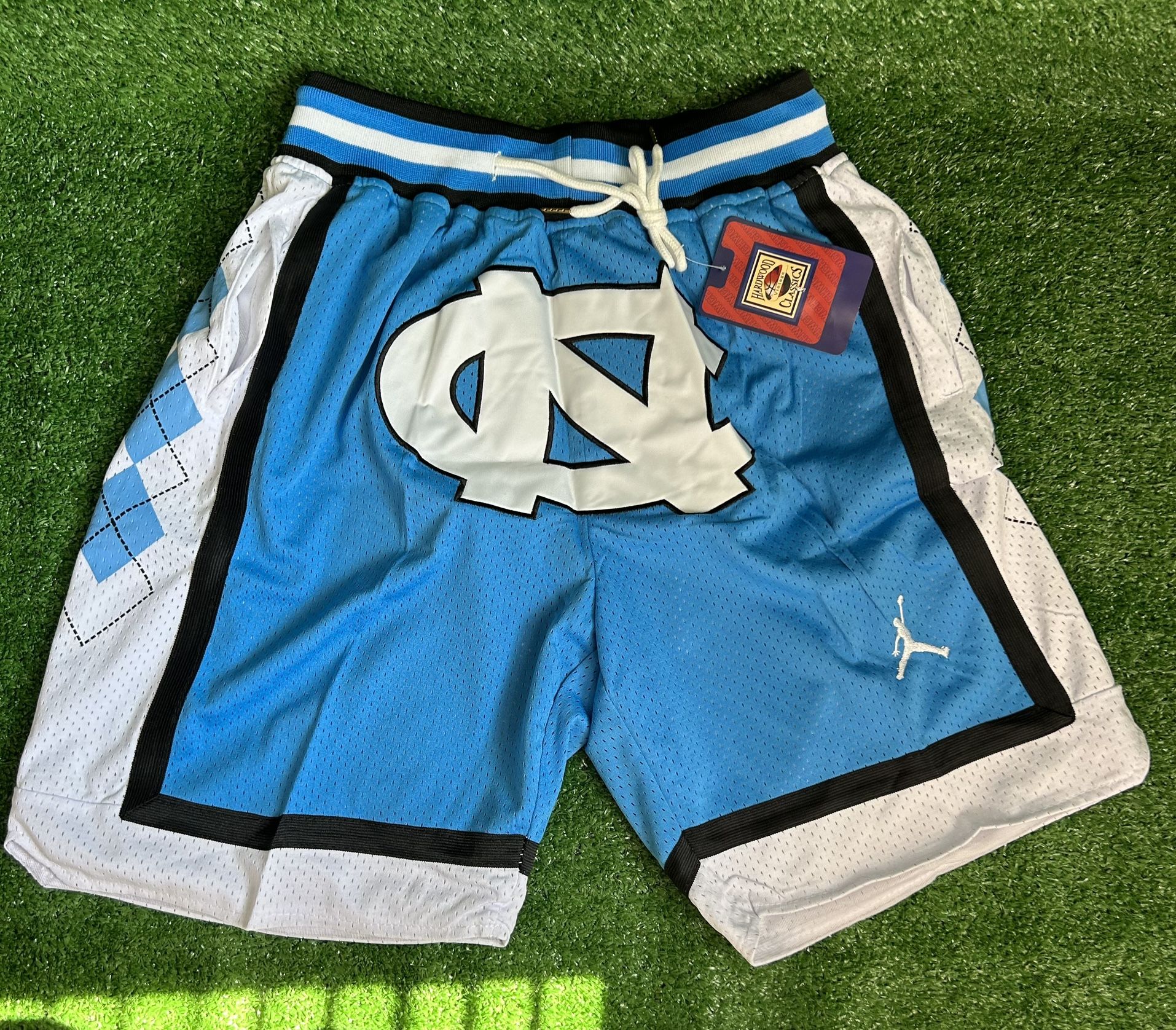 NORTH CAROLINA TAR HEELS JUST DON BASKETBALL SHORTS BRAND NEW WITH TAGS SIZES MEDIUM AND LARGE