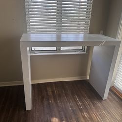 Tall White Table (55” X 24” X 42”)