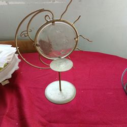 I Have A Candle Stand When You Put A Candle Figure Behind It With Clothes And Shadows Of A Baby With Stars And Also A Towel