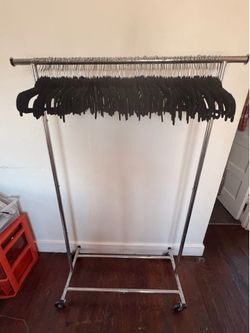Rolling clothes rack with hangers