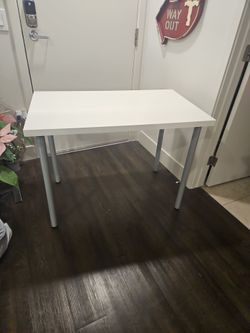 White table with Stainless Steel legs